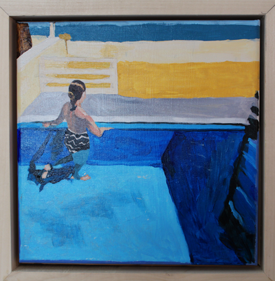 View from behind a woman in an outdoor pool looking across the beach into the ocean