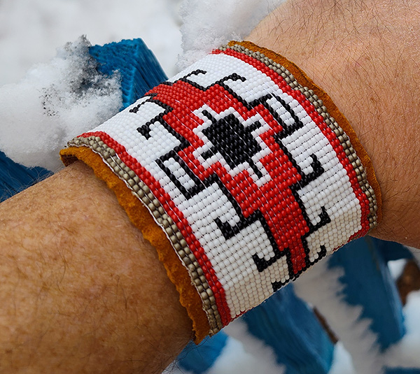 Hand beaded cuff with traditional native American design
