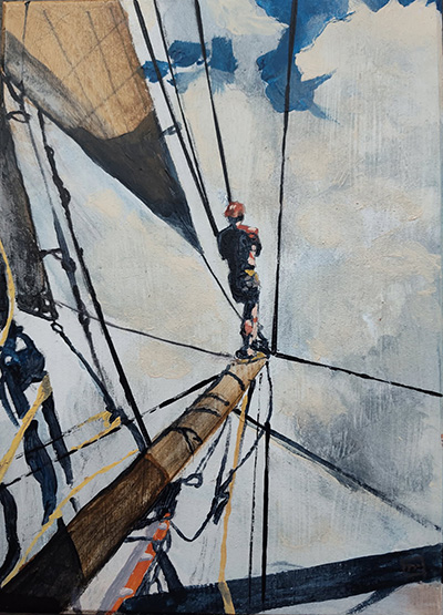 person out on the front of a sailing ship bowsprit